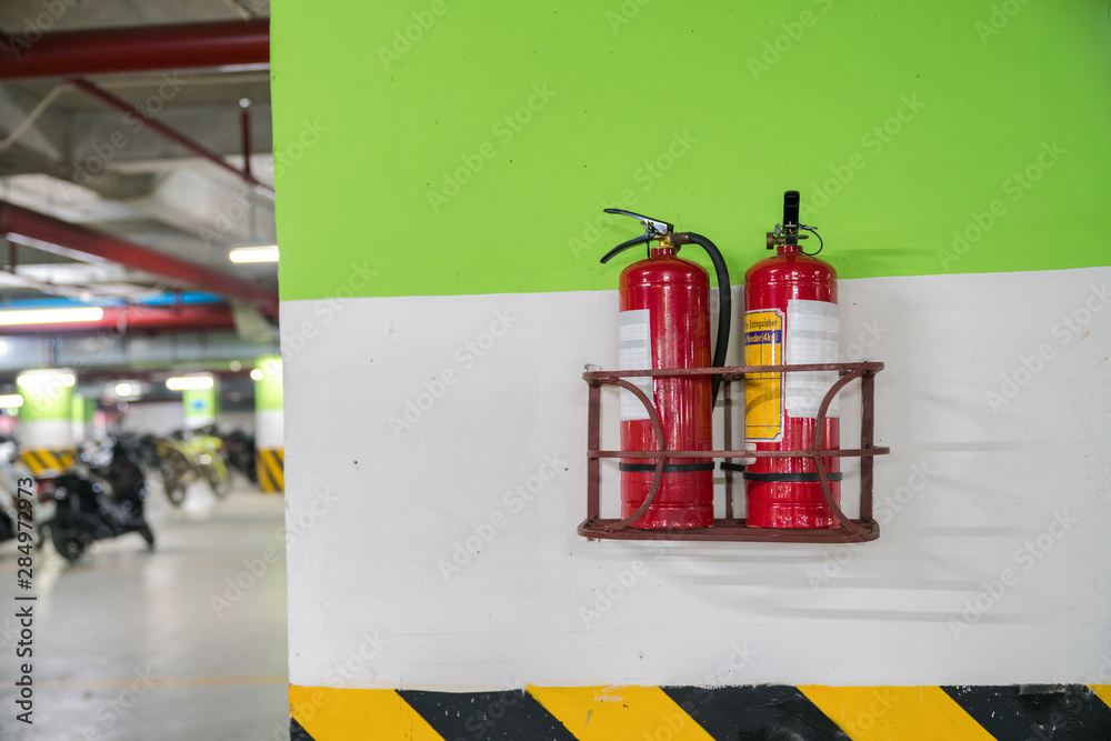 Fire extinguisher in underground basement motorbike parking