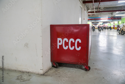 Firefighting box with sand in underground parking of modern building