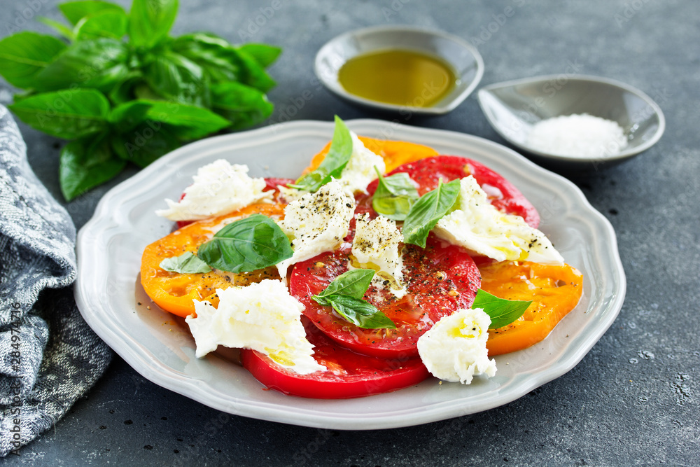 salad of tomato, mozzarella and basil. Italian food. salad of tomato, mozzarella and basil. Italian food.
