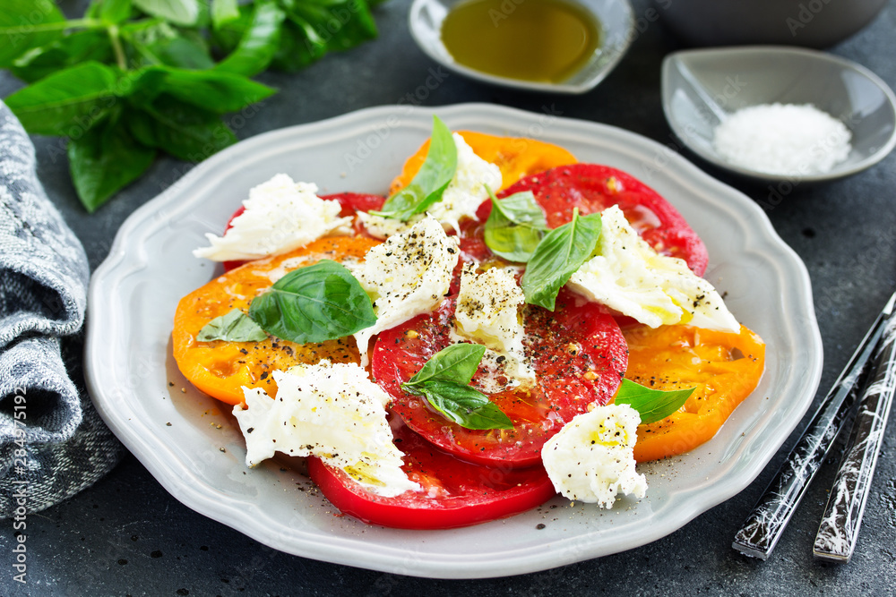 salad of tomato, mozzarella and basil. Italian food. salad of tomato, mozzarella and basil. Italian food.