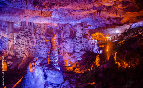 Colorful illuminated stalactites at Stalactites Cave also known as Soreq Cave and Avshalom Cave