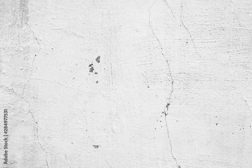 Obraz premium Texture of a concrete wall with cracks and scratches which can be used as a background