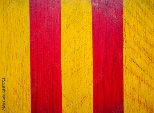 Wood texture. Applied to the surface acrylic stripes in red and yellow