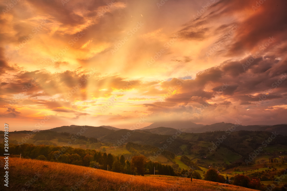 Mountain valley during sunset. Natural autumn landscape