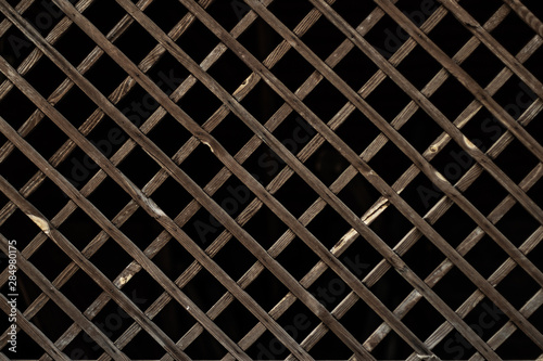 Wooden grill with a dark background