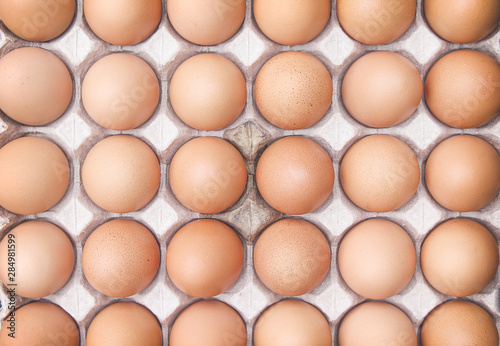 Fresh thirty raw eggs with nature  in the carton box tray  top view organic background