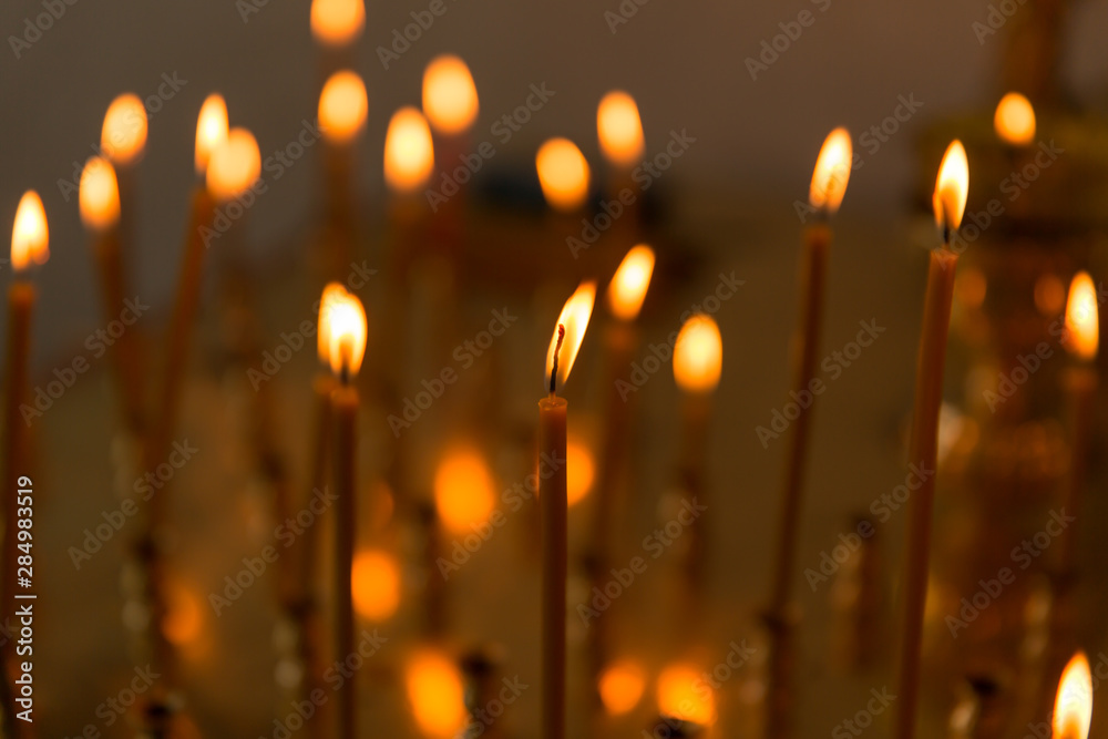 Christmas candles burning at night in the church. Christmas candles burning at night in the church.