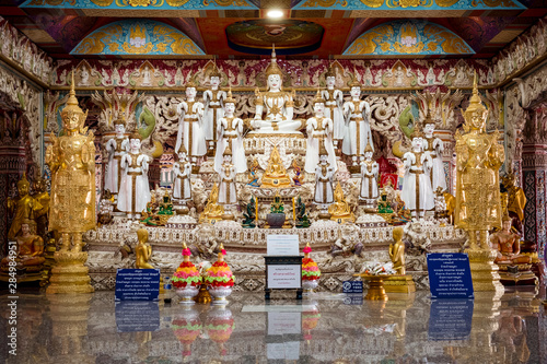 White Buddha statues and exquisite deity in Thai temples. © Suwichak Photograph