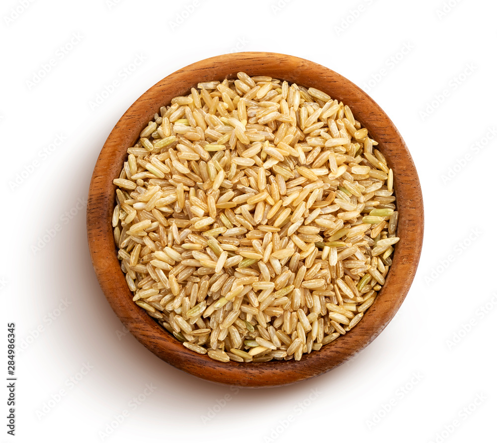 Brown rice groats isolated on white background, top view