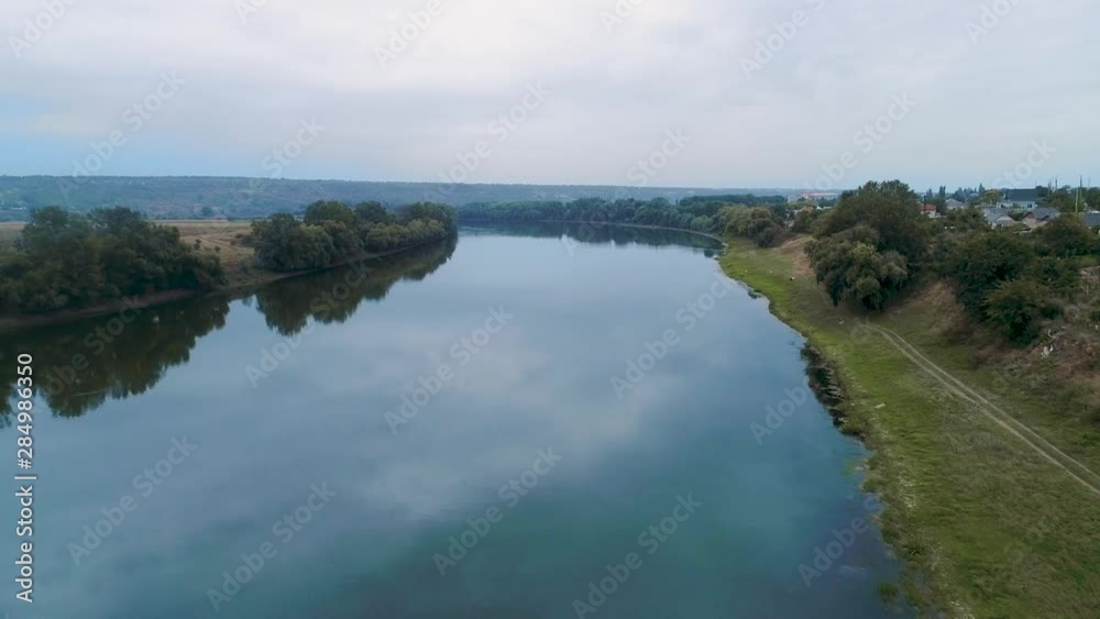 Aerial view of beautiful trees and their reflections in a river. Aerial view of beautiful trees and their reflections in a river.
