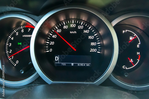 The dashboard of the car, on the speedometer 50 km\h. Observe the speed limit.