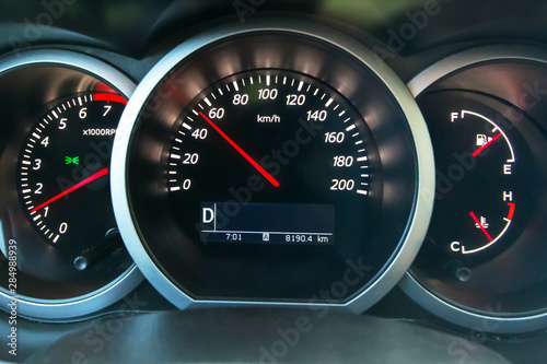 The dashboard of the car, on the speedometer 50 kmh. Observe the speed limit.