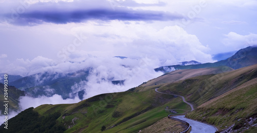 Road and clouds between the mountains in the high of Larrau  Pyrenees of France