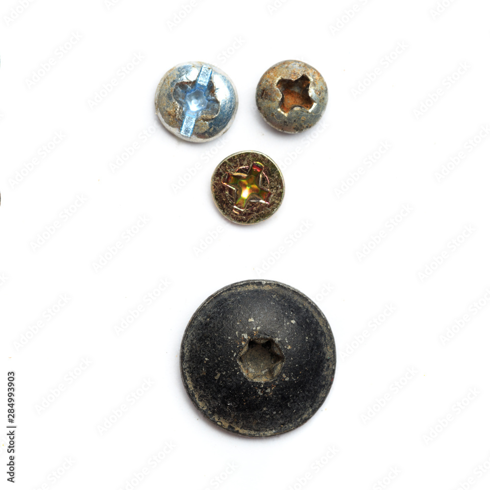 Screw heads, nuts, rivets isolated on white. Screw heads, nuts, rivets isolated on white.