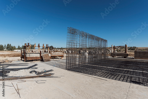 iron structures and welds on the outside of a factory ready to be used in construction photo