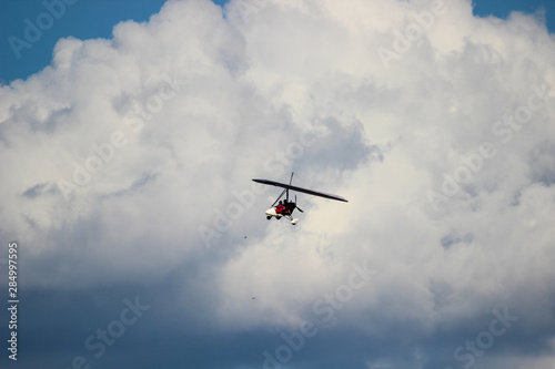 Motorized glider in the clouds