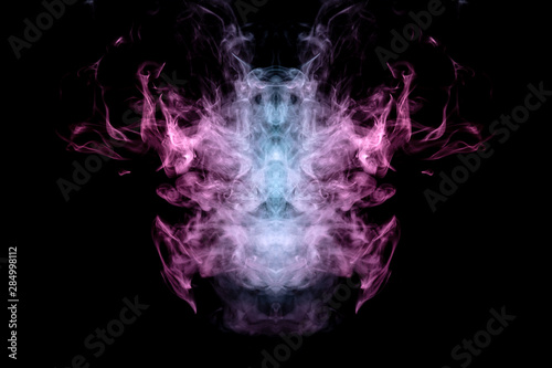 Smoke of different blue, red and pink colors in form of horror in the shape of the head, face and eye with wings on a black isolated background. Soul and ghost in mystical symbol. Print for clothes.