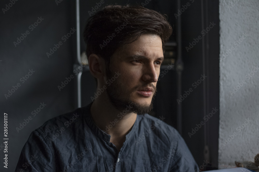 Obraz premium Portrait of pensively young man