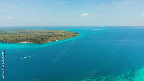 Tropical islands with coral reefs in the blue water of the sea, aerial view. Balabac, Palawan, Philippines. Summer and travel vacation concept.