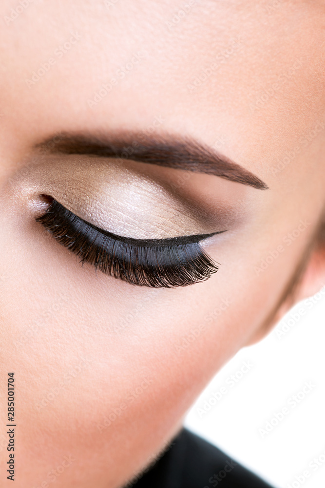 Female eye with beautiful fashion makeup.