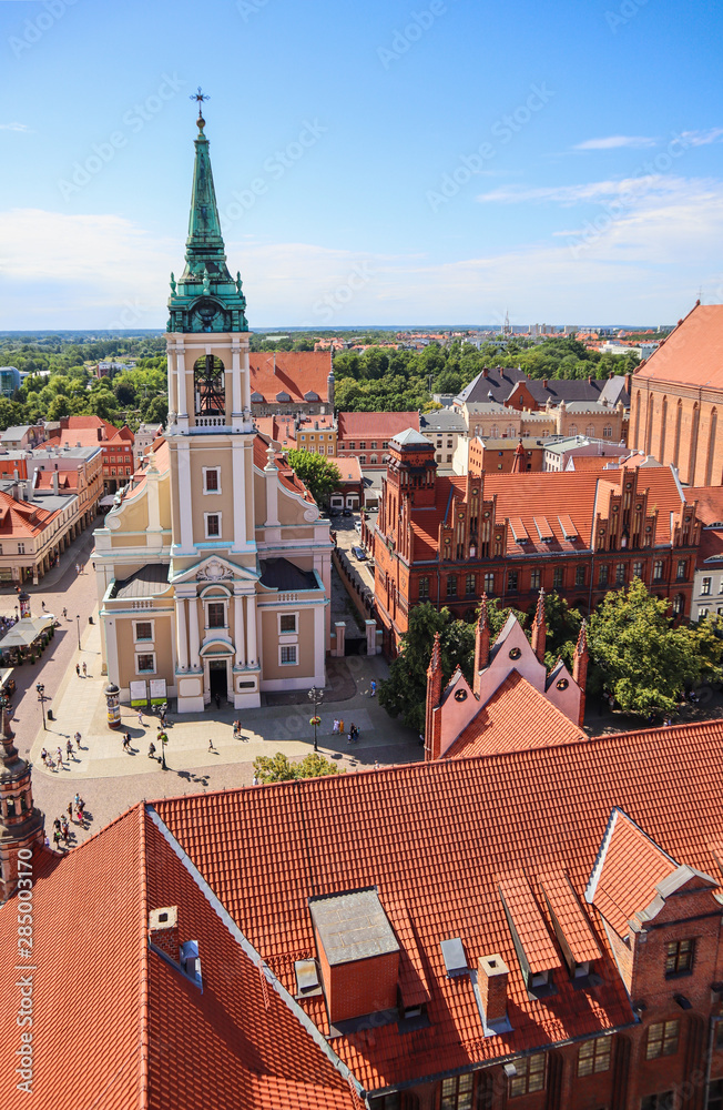 Aerial view on Holy Spirit Church and historical buildings of medieval town Torun, Poland. August 2019