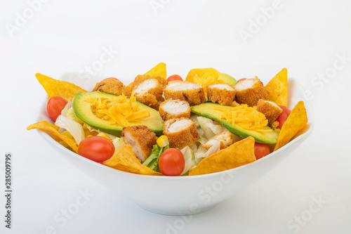 Crunchy Chicken Avocado Salad isolated on white background