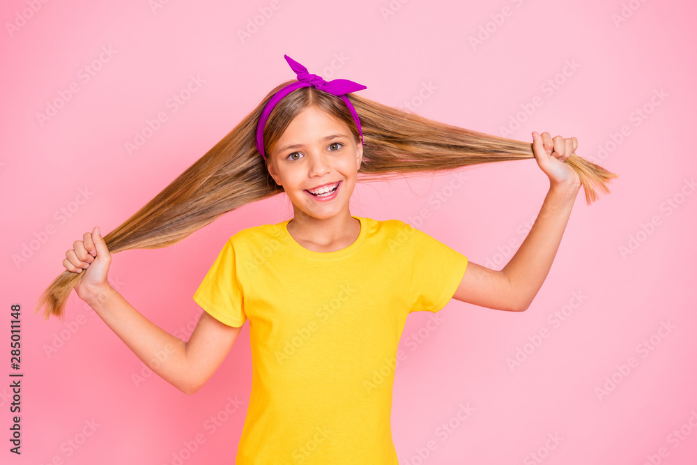 Close-up portrait of her she nice-looking well-groomed attractive lovely shine cheerful cheery pre-teen girl wearing yellow t-shirt demonstrating silky hair isolated over pink pastel background Close-up portrait of her she nice-looking well-groomed attractive lovely shine cheerful cheery pre-teen girl wearing yellow t-shirt demonstrating silky hair isolated over pink pastel background