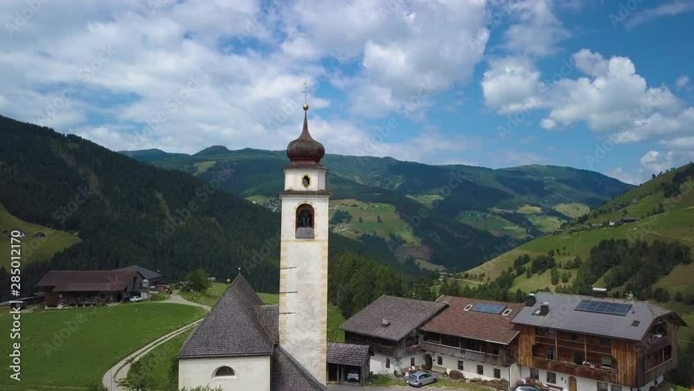 Aerial Flight over small alpine village in the Dolomites. European Alps. Tyrol. Pieve di Marebbe. 4K Aerial Flight over small alpine village in the Dolomites. European Alps. Tyrol. Pieve di Marebbe. 4K