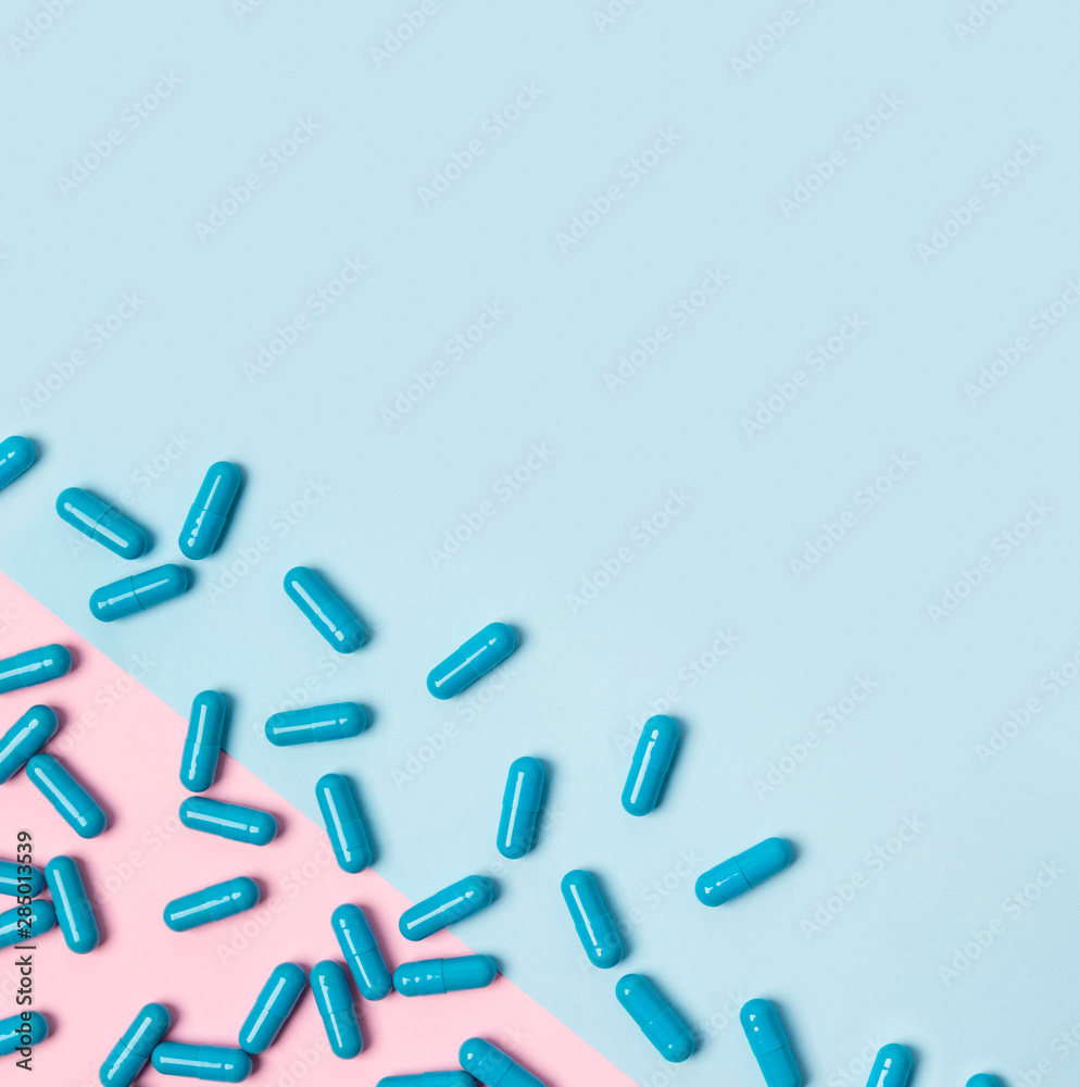Flat lay with blue pills at creative background. Empty place for text. Flat lay with blue pills at creative background. Empty place for text.