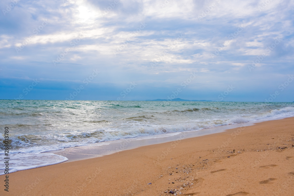 Summer vacation view of the blue sky with beautiful sea. wave ocean on sandy beach. for travel in the holidays. nature background.