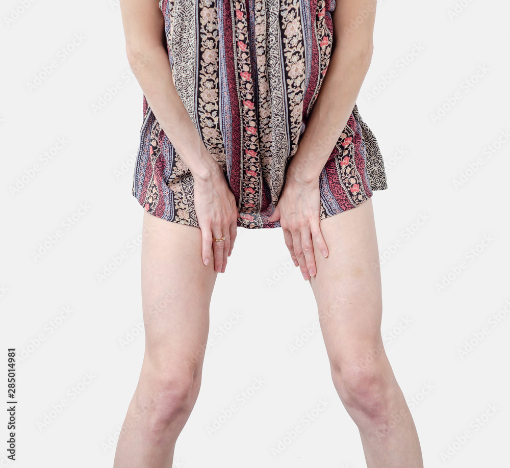 Young woman in a dress, body, legs, stands in a sexy pose, spreading legs  Isolated on white background. Stock Photo | Adobe Stock