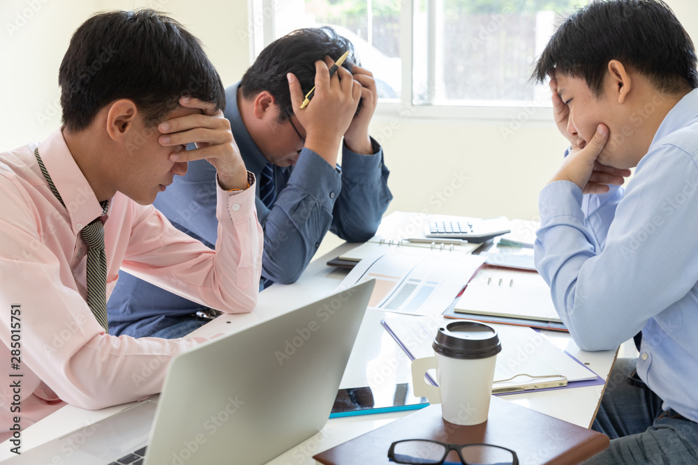 Business and finance concept of office working,Teamwork of Businessmen stressing after investment business plan not success Business and finance concept of office working,Teamwork of Businessmen stressing after investment business plan not success
