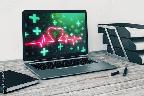 Laptop closeup with human heart drawing on computer screen. Education concept. 3d rendering.