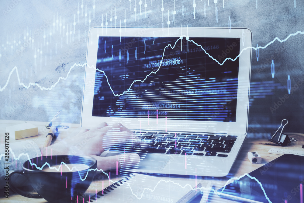 Forex graph with businessman working on computer in office on background. Concept of hardworking. Double exposure. Forex graph with businessman working on computer in office on background. Concept of hardworking. Double exposure.