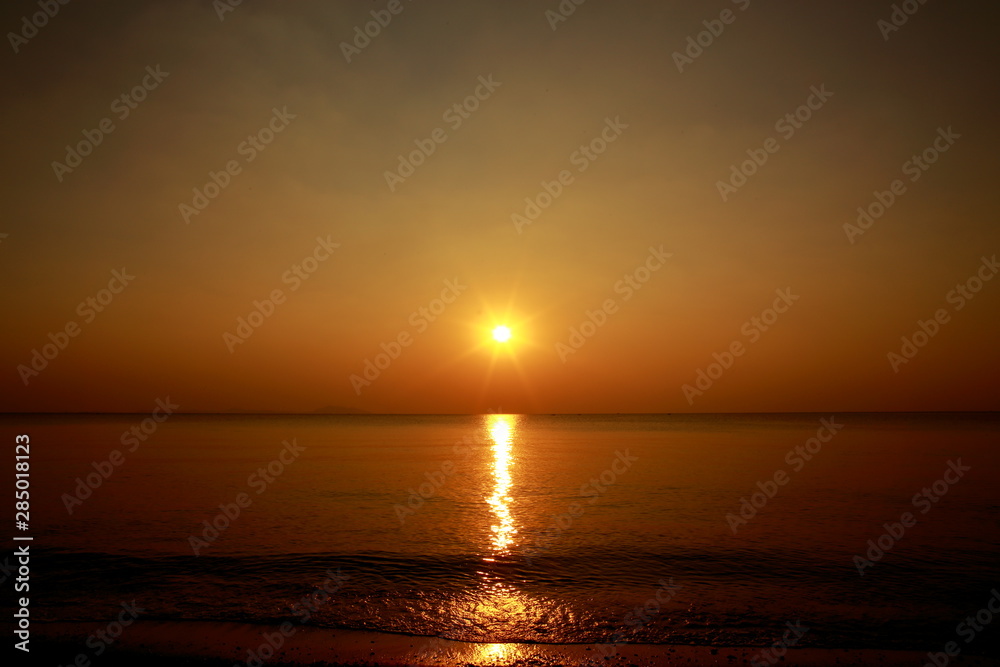 Fototapeta premium Sunset above the sea with beautiful sky