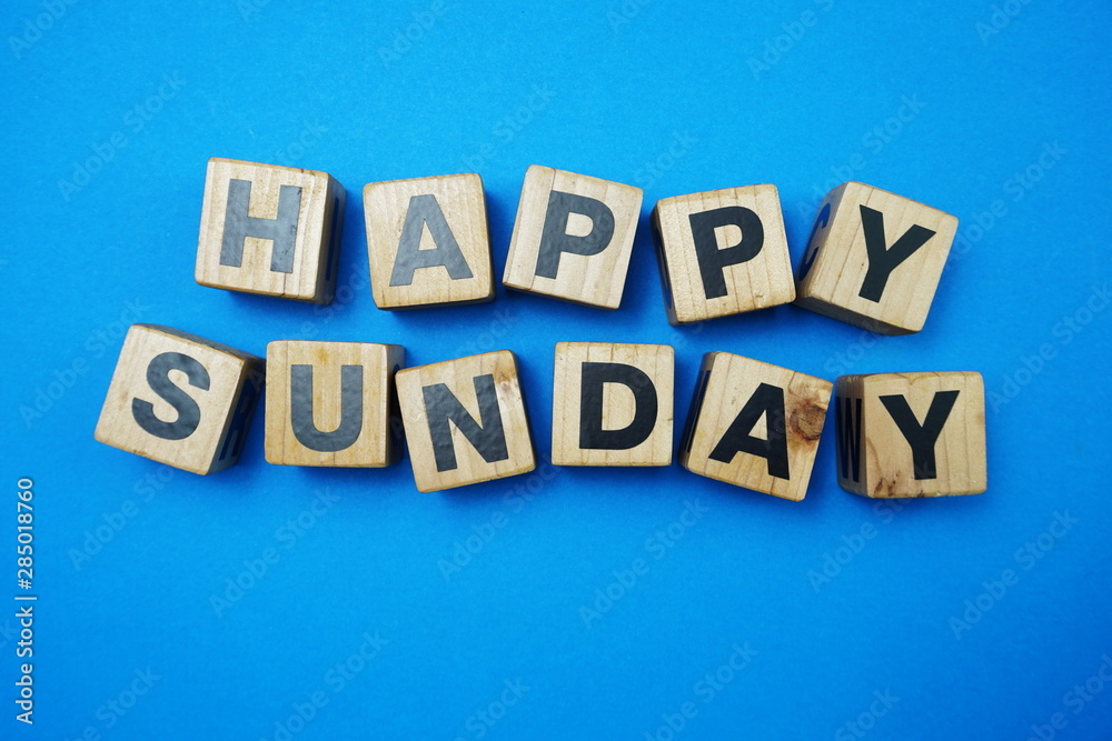 Obraz premium Happy Sunday alpahbet letter Top view on blue background