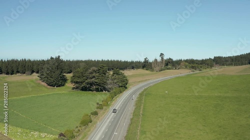 Aerial view car driving down New Zealand State Highway One Road photo