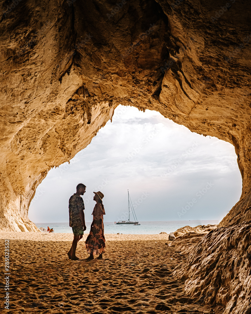 Φωτογραφία Caves of Cala Luna beach Sardinia Orosei coast, couple on the beach of Cala Luna