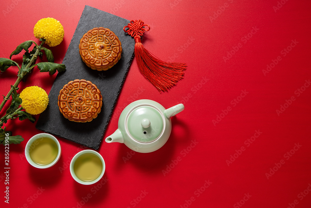 Obraz na plátně Chinese Mid-Autumn Festival cuisine, mooncakes and tea on a red background