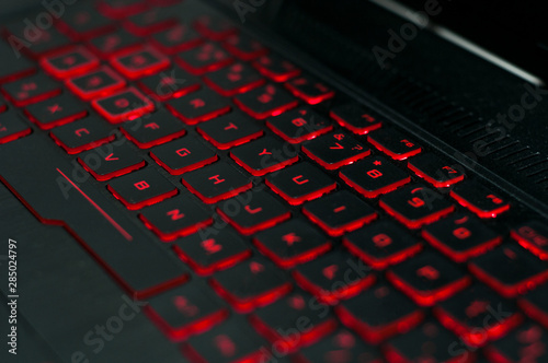 gaming keyboard with red backlight. laptop keyboard