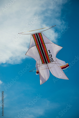 BALI, INDONESIA - OCTOBER 2018: Playing with Layang-Layang photo