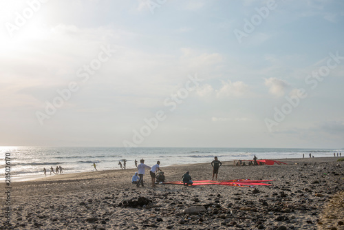 BALI, INDONESIA - OCTOBER 2018: Playing with Layang-Layang photo