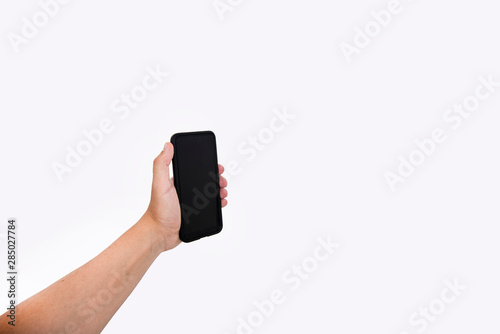 Man hand holding black cellphone with black screen at isolated background.