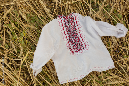 white embroidery on wheat. embroidered shirt. Ukrainian embroidery photo