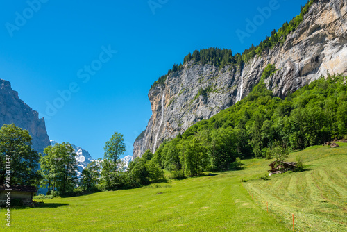 Landscape in the Lauterbrunnen valley with the Spissbach Falls in Lauterbrunnen
