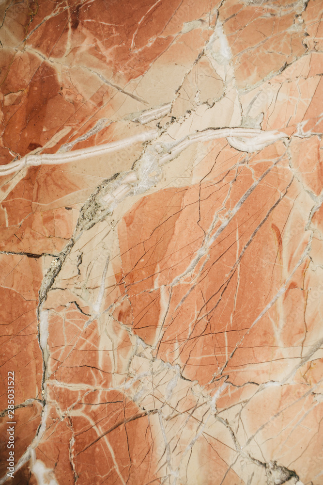 Marble surface as texture and background for design. Orange marble texture.   