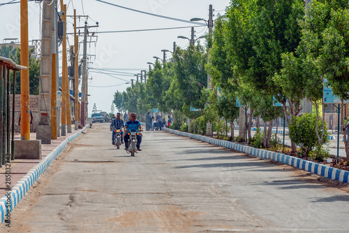 Wallpaper Mural 11/05/2019 Hormuz, Hormozgan Province, Iran, motorcyclists ride along the avenue on a sunny and hot day. Torontodigital.ca