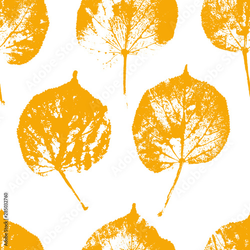Vector seamless patten with warm yellow color autumn linden leaves on white.