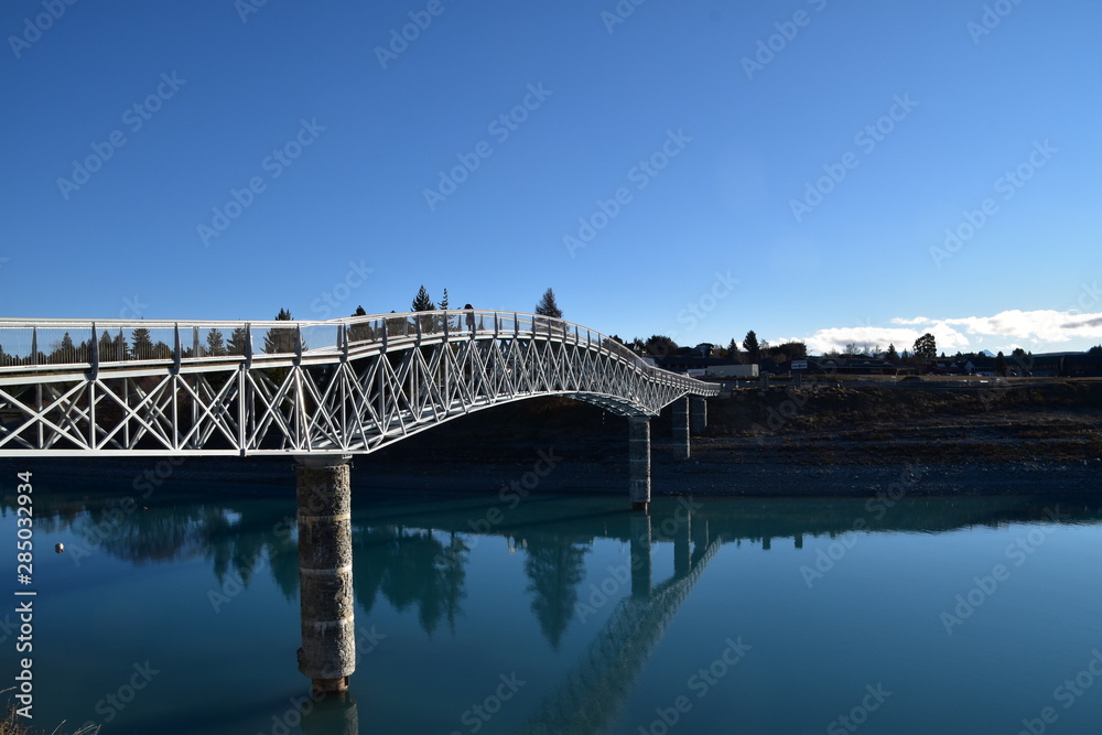 Fototapeta premium Landscape with a bridge and Lake Tekapo in New Zealand