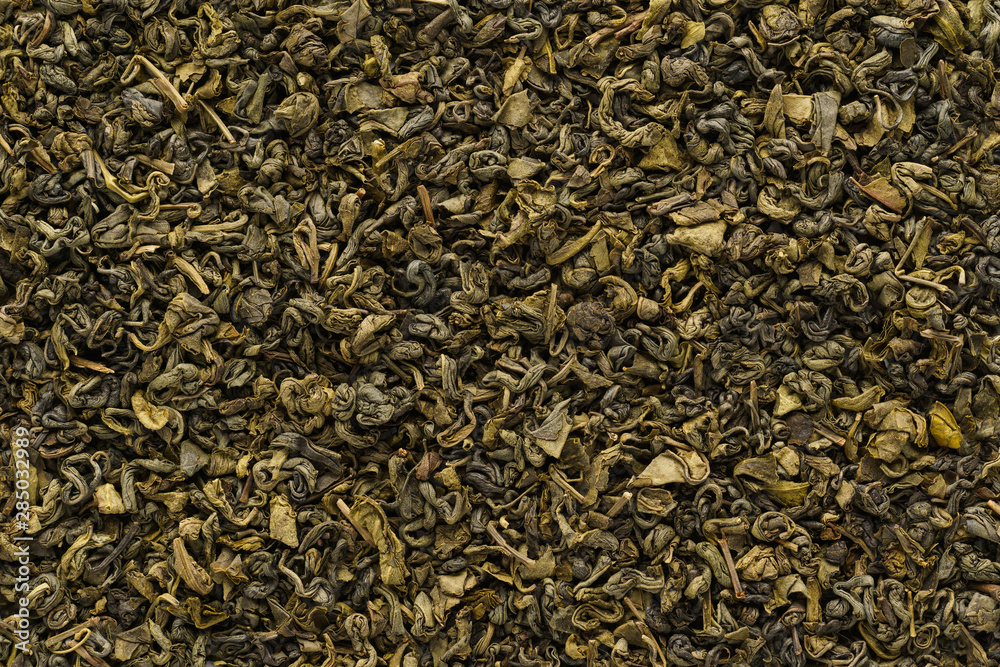 Dry oolong tea leaves as a background. Shot from above. Dry oolong tea leaves as a background. Shot from above.